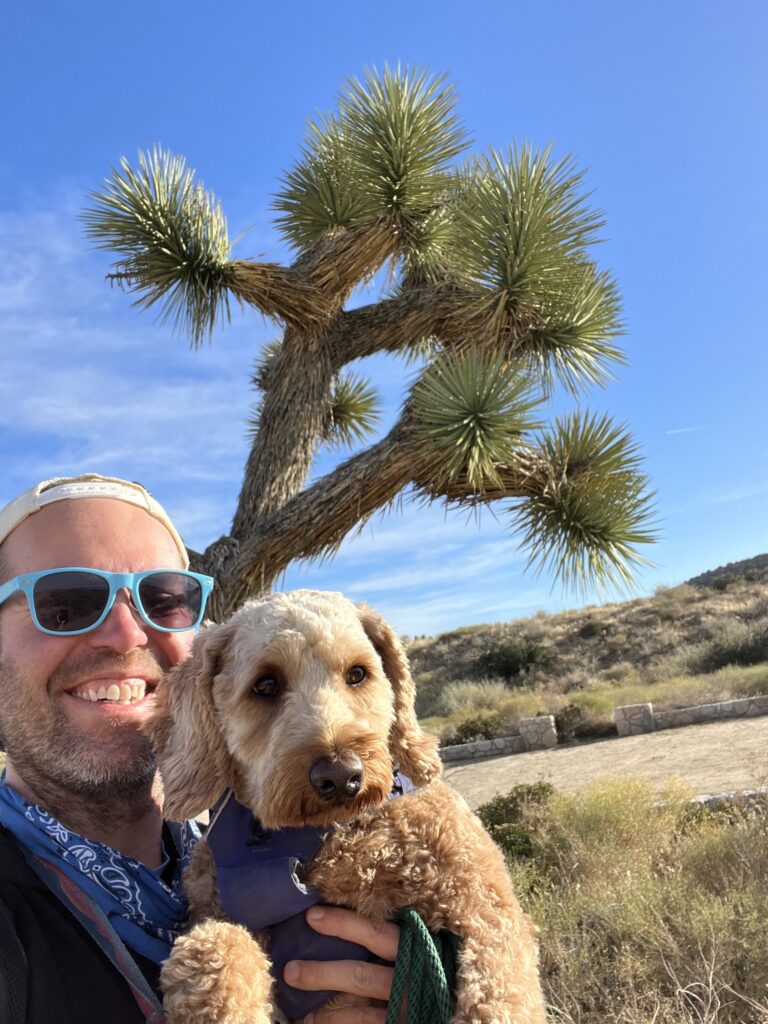 Joshua Trees Selfie with my serious hiking dog ;). The yucca trees flourish in the hi-desert of the Coachella Valley.